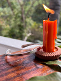 Flint striker being used to ignite a fire with a blurred natural background
